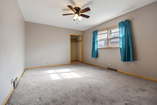 unfurnished bedroom with a closet, baseboards, and carpet flooring