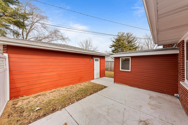 exterior space with fence and an outdoor structure