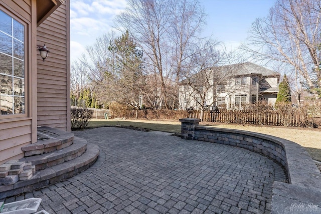 view of patio / terrace featuring fence