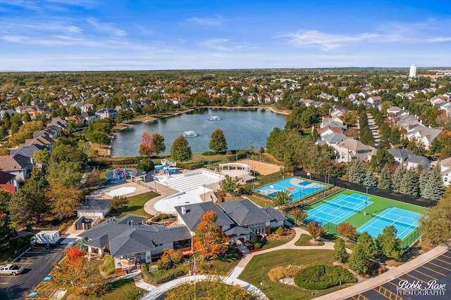 birds eye view of property with a residential view and a water view