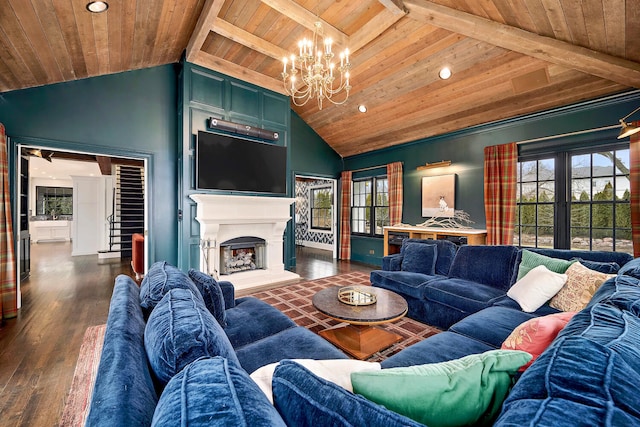 living area with a fireplace with raised hearth, dark wood finished floors, wood ceiling, a chandelier, and stairs