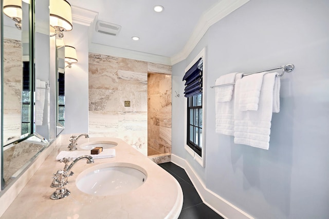 full bath with a sink, tile walls, ornamental molding, and tile patterned flooring