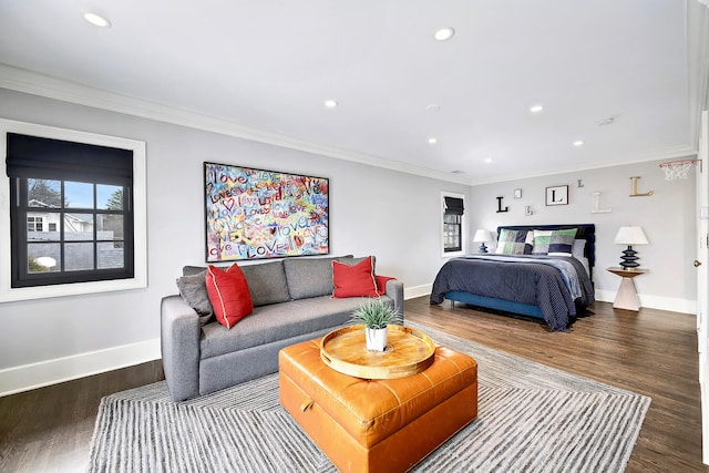 bedroom with crown molding, multiple windows, and wood finished floors