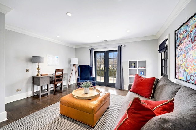 interior space featuring wood finished floors, french doors, baseboards, and ornamental molding