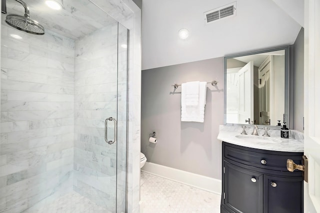 bathroom with visible vents, a shower stall, baseboards, toilet, and vanity