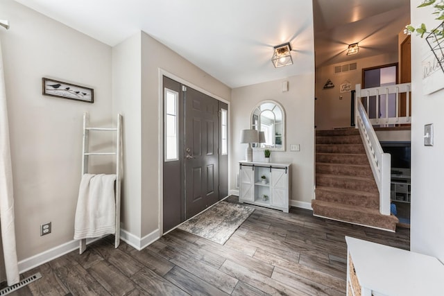 entrance foyer featuring stairs, wood finished floors, visible vents, and baseboards