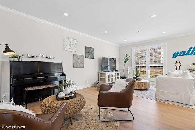 living area featuring ornamental molding, recessed lighting, wood finished floors, and baseboards