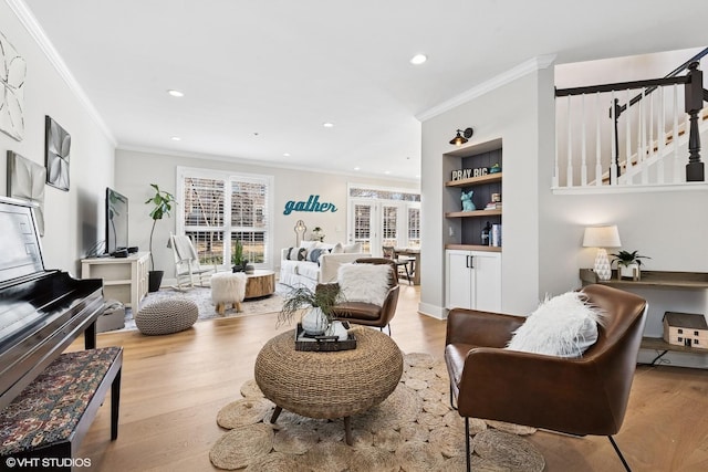 living area with ornamental molding, wood finished floors, and recessed lighting