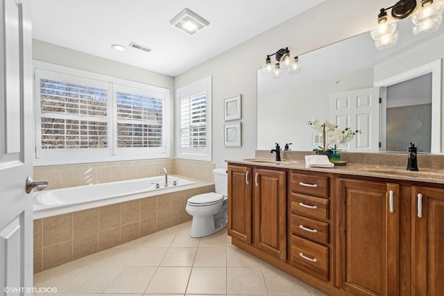 full bath featuring tile patterned flooring, a sink, toilet, and a bath