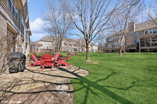 view of yard with a patio area and a fire pit