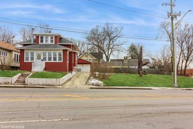 view of front of house featuring a front yard and fence