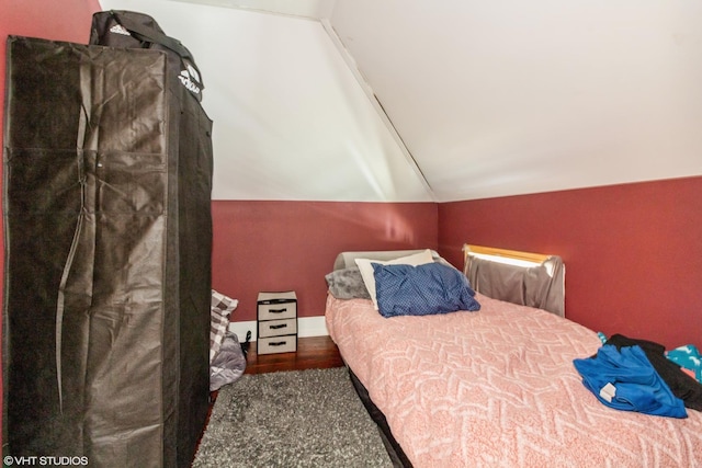 bedroom with lofted ceiling