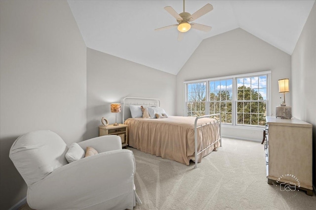 bedroom with vaulted ceiling, a ceiling fan, and light colored carpet