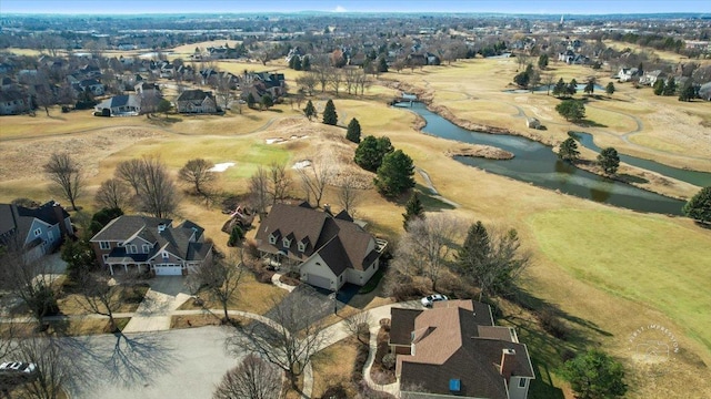 bird's eye view featuring a water view and a residential view