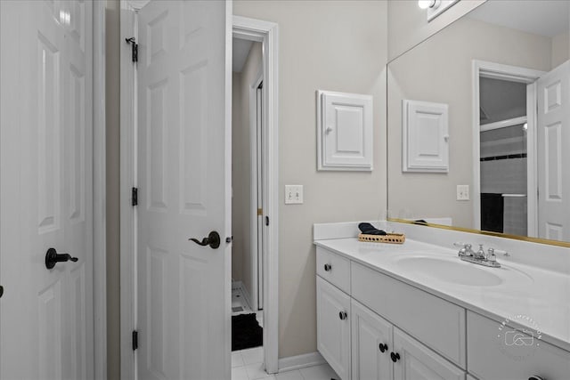 bathroom featuring tile patterned flooring and vanity