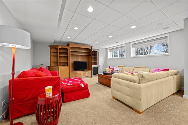 carpeted living area with recessed lighting