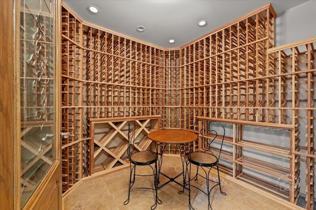 wine cellar with recessed lighting and tile patterned floors