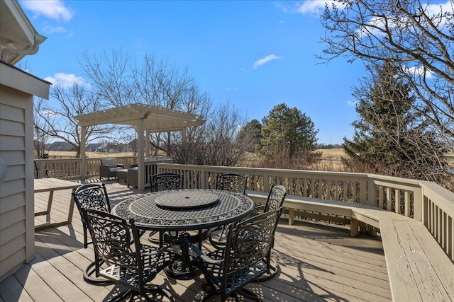 wooden terrace with outdoor dining area