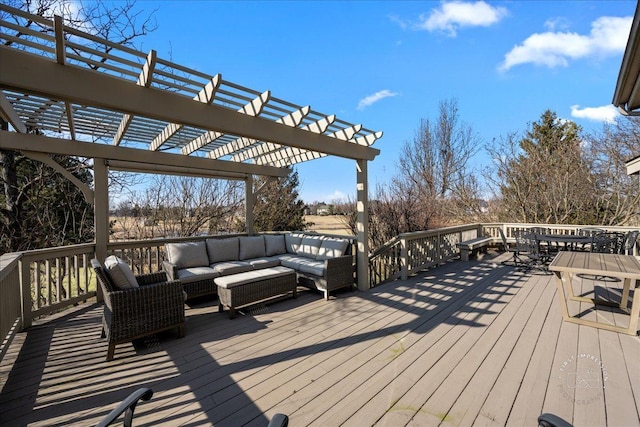 deck featuring outdoor lounge area, a pergola, and outdoor dining space