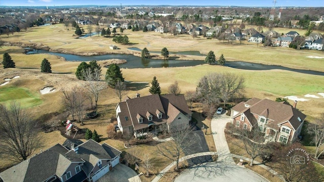 birds eye view of property with a residential view and a water view