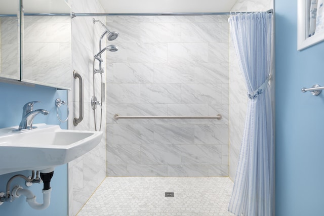 full bath featuring a tile shower