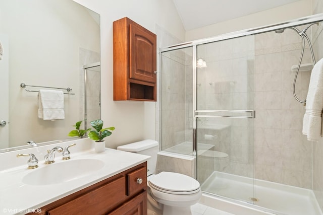 full bath with toilet, a shower stall, lofted ceiling, and vanity