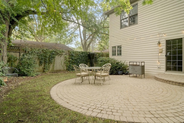 view of patio with outdoor dining area and a fenced backyard