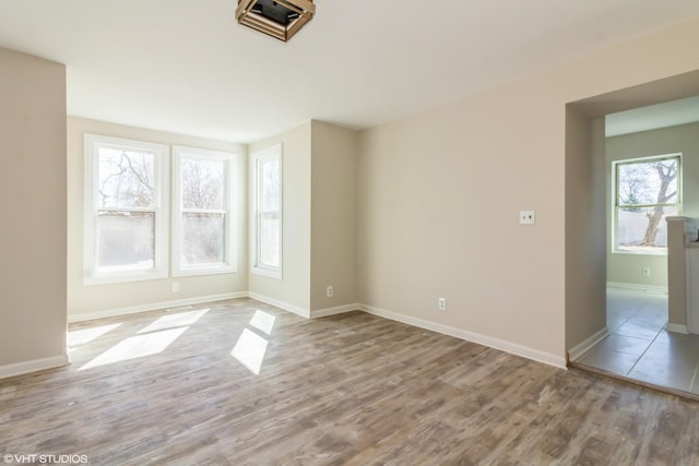 1803 Guion St, Ottawa, IL 61350 - spare room with baseboards and wood finished floors
