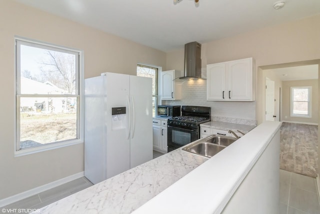 1803 Guion St, Ottawa, IL 61350 - kitchen with island exhaust hood, stainless steel microwave, a sink, white fridge with ice dispenser, and black range with gas stovetop