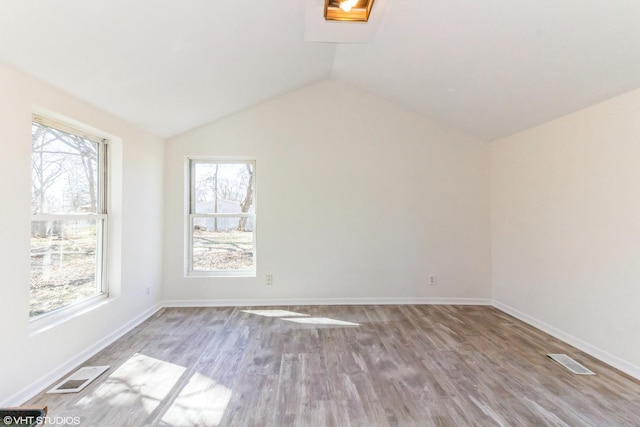 1803 Guion St, Ottawa, IL 61350 - unfurnished room with visible vents, lofted ceiling, baseboards, and wood finished floors