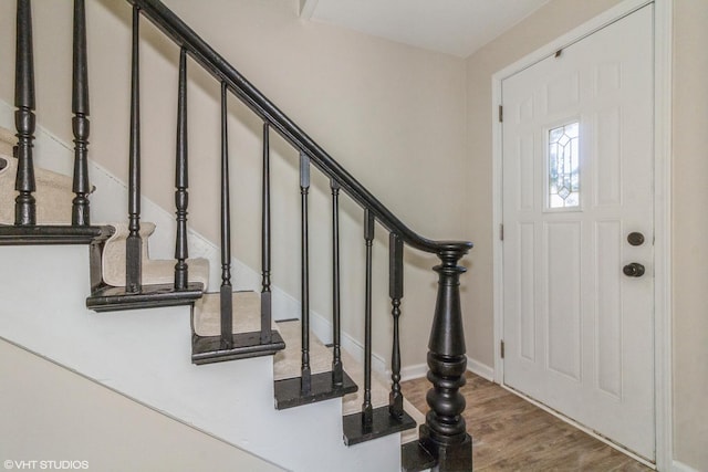 1803 Guion St, Ottawa, IL 61350 - foyer entrance featuring baseboards, wood finished floors, and stairs