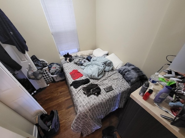 bedroom with wood finished floors