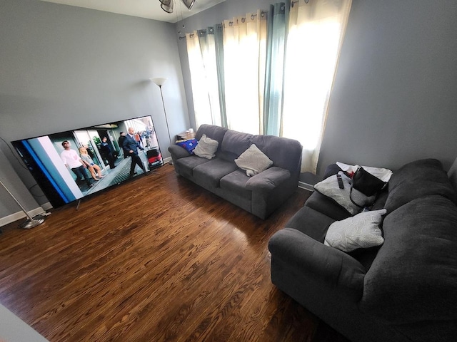 living room featuring wood finished floors and baseboards