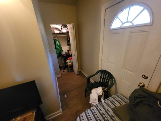 entrance foyer with wood finished floors and baseboards