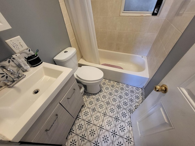 bathroom featuring shower / bath combination with curtain, tile patterned flooring, vanity, and toilet