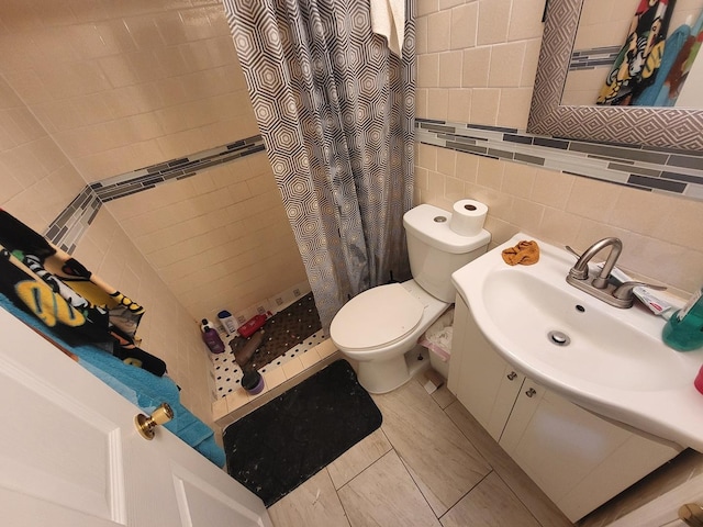 full bath featuring tile walls, a shower stall, toilet, and vanity