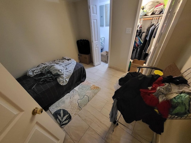 bedroom featuring a closet and a walk in closet