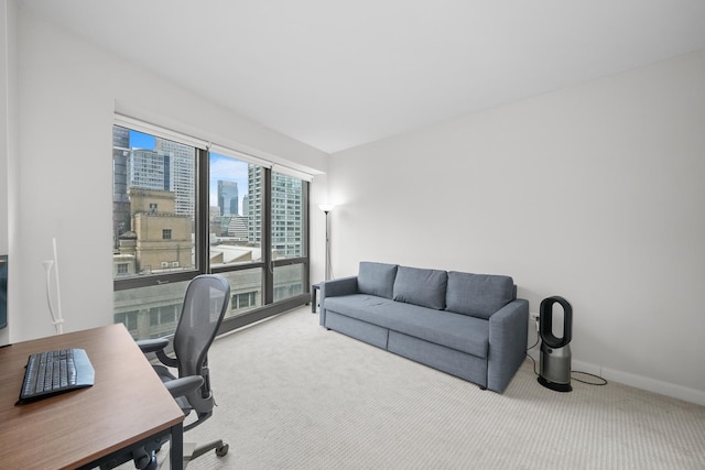 office area with carpet, a view of city, and baseboards