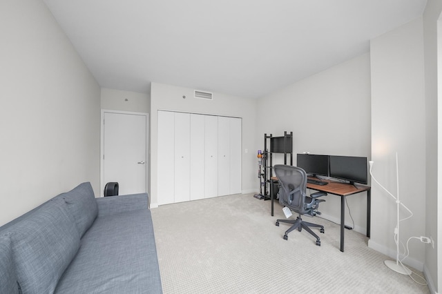 carpeted home office with baseboards and visible vents