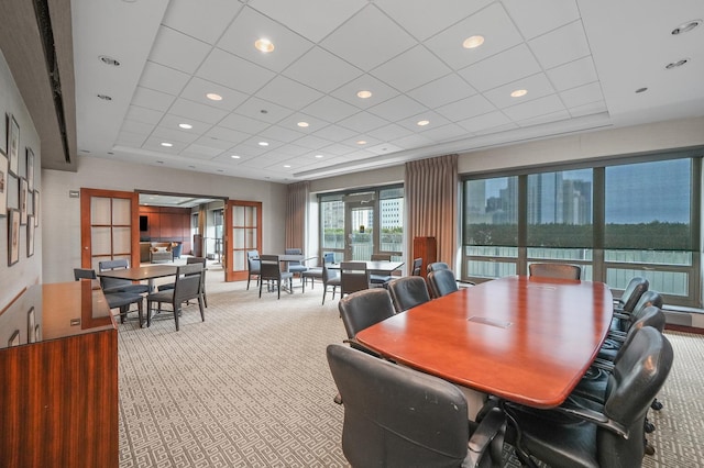 dining space with carpet floors, a drop ceiling, and recessed lighting