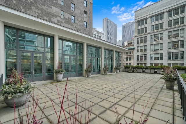 view of home's community with a city view and a patio