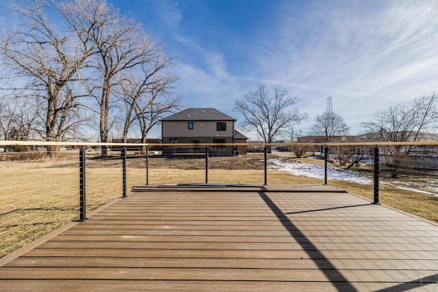 wooden terrace with a lawn