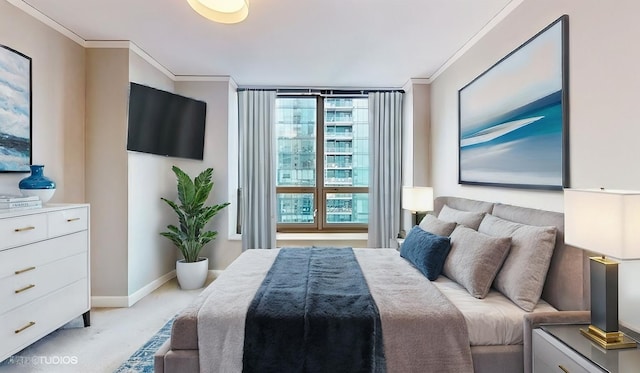 bedroom with baseboards, crown molding, and light colored carpet