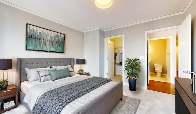 bedroom featuring light carpet, baseboards, a spacious closet, and ornamental molding