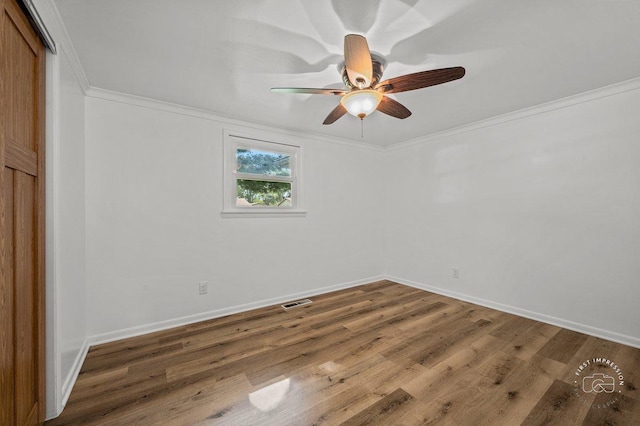 unfurnished room with ceiling fan, baseboards, wood finished floors, and crown molding