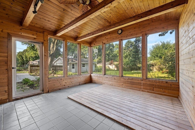 unfurnished sunroom featuring vaulted ceiling with beams and wooden ceiling