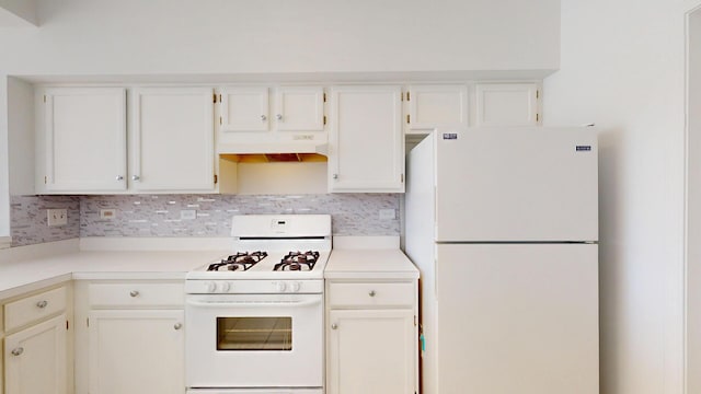 kitchen with under cabinet range hood, white appliances, white cabinetry, and light countertops