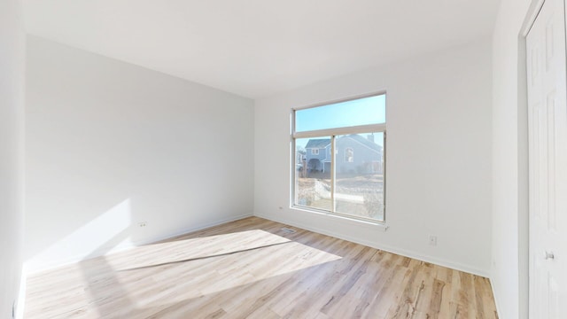 spare room with visible vents and light wood-style floors