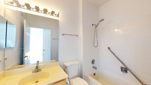 bathroom with vanity, toilet, and bathing tub / shower combination