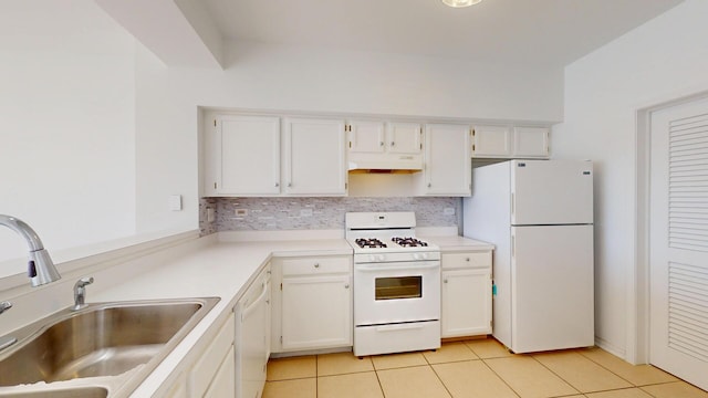 kitchen with a sink, white appliances, under cabinet range hood, and white cabinets